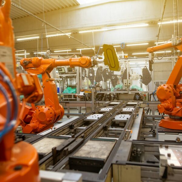 a factory filled with lots of orange machines